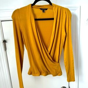 Banana Republic yellow blouse. Wrap shape to fit your curves.